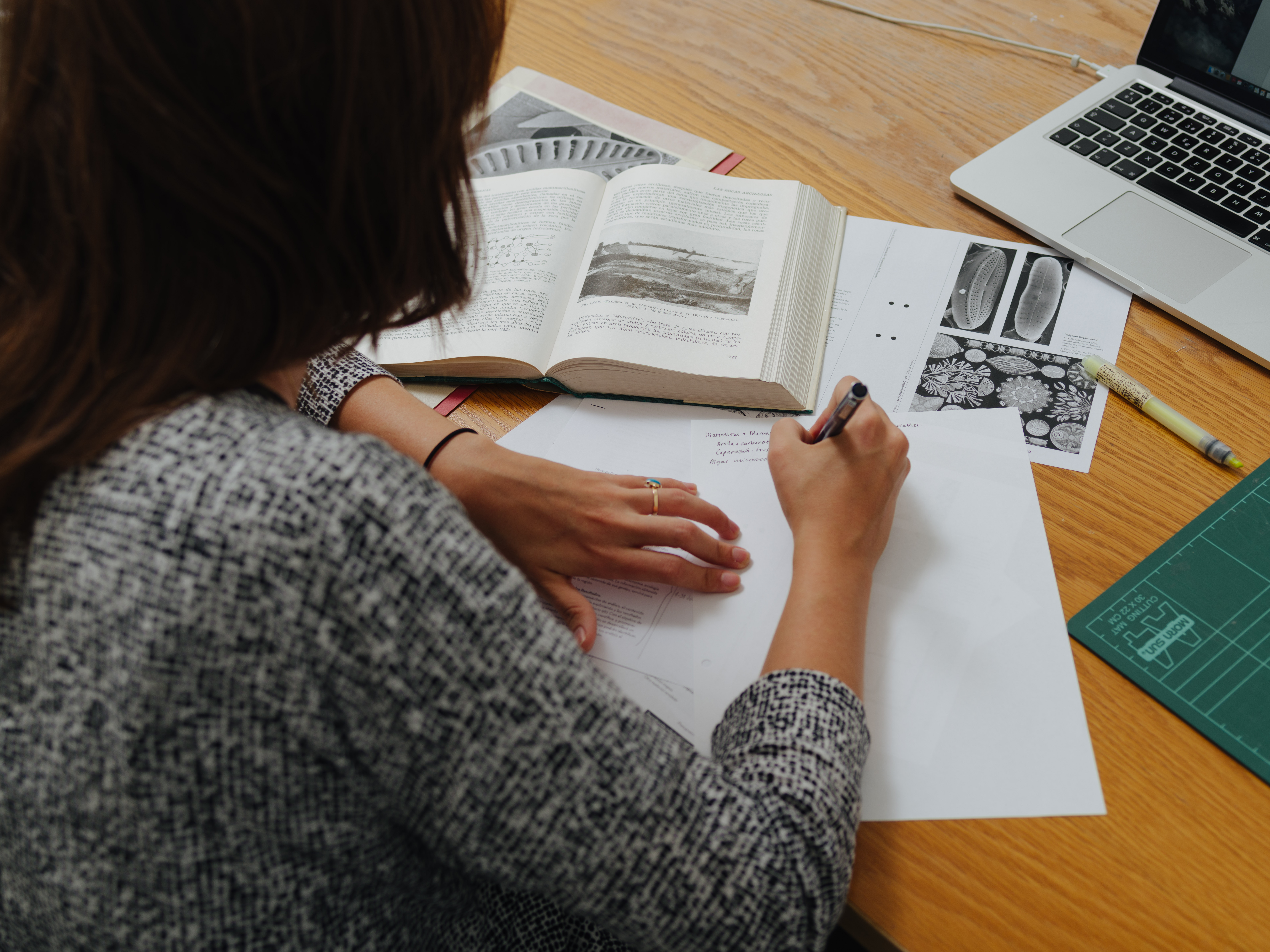 Writer working on manuscript
